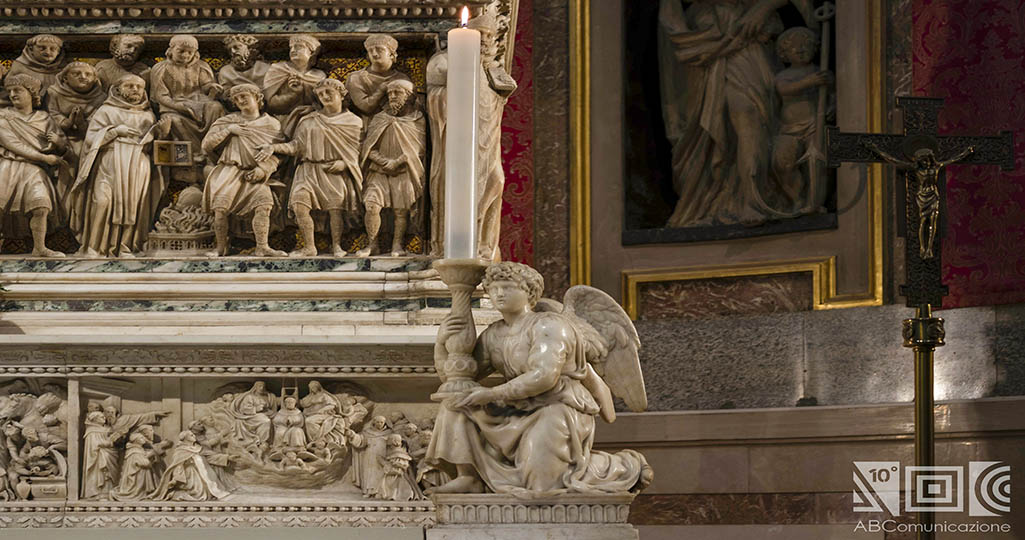 Michelangelo's  right-hand candle-holding angel